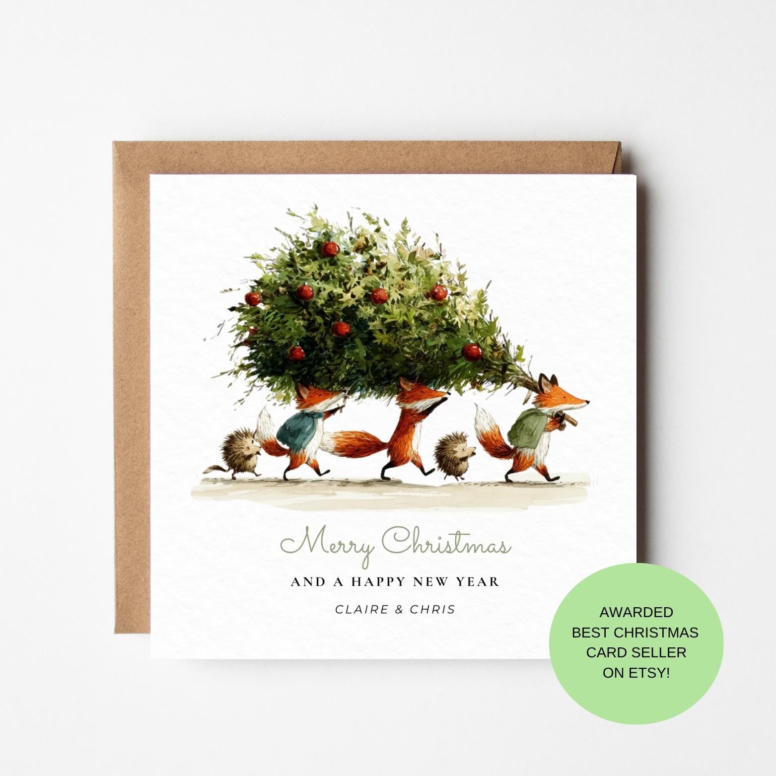 Woodland Animals Christmas Card – Foxes Carrying Tree, Whimsical Countryside Holiday Card